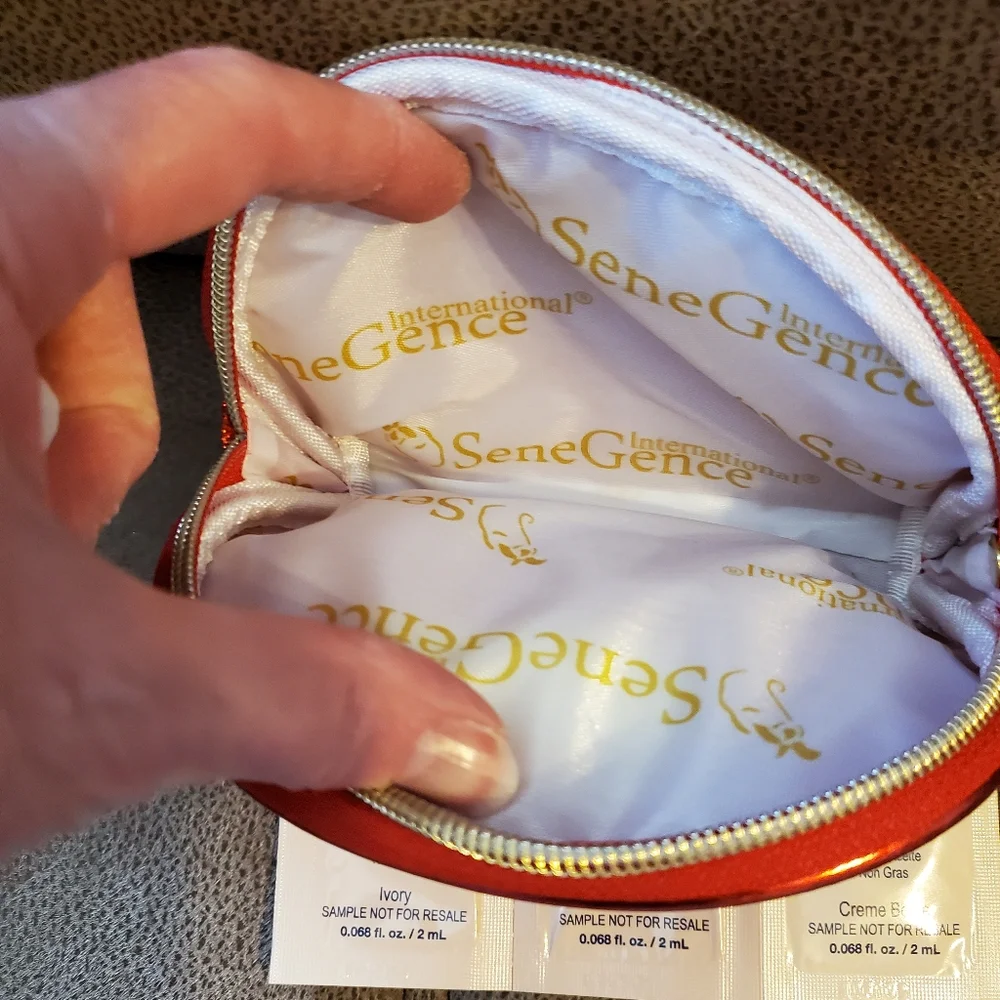 SeneGence red glitter makeup bag with foundation samples